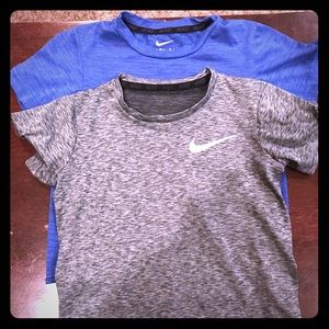 Two boys Nike Dri-Fit shirts